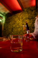 A trendy bar with elegant glassware and ambient lighting for a perfect atmosphere