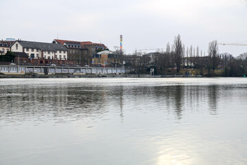 A picturesque view of Heidelberg, Germany, featuring the city’s historic architecture, lush green hills, and the iconic Neckar River. The blend of old and modern elements creates a timeless atmosphere