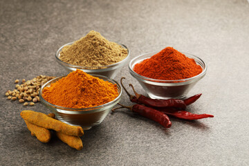 Various spices in a bowls on stone background. Mix spices Indian spices food and cuisine ingredients