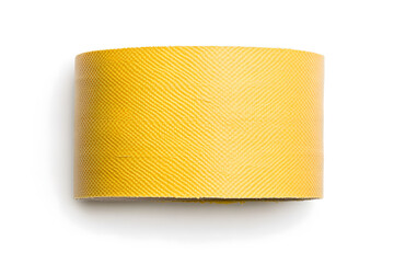 Roll of gold or yellow textured material isolated on white. Macro shot with a uniform diagonal pattern. Studio lighting, with visible shadow beneath.
