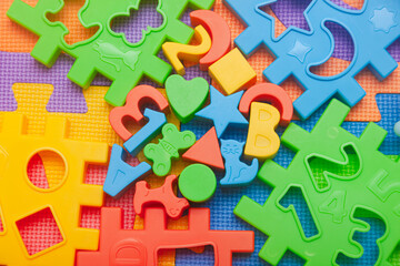Children's educational toys on a play mat.
