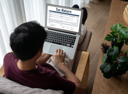 Online tax return form for submitting individual income tax return form snugly on the internet website. Government web for tax payment and return. Taxation technology concept.