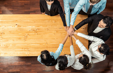Multiracial business people make synergy hand stack together in meeting room as cooperation or team...