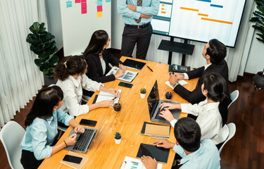 Project manager planning schedules for business task at meeting room, Gantt chart software show on...