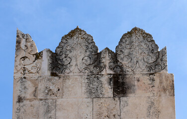Naklejka premium Yağ Mosque in Adana is one of the oldest and historic mosques in the city, with Seljuk architectural motifs and stonework above the courtyard entrance.