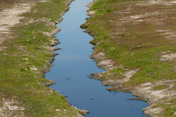 Seyhan River in the city center of Adana, which almost looks like a stream due to the water being retained for a bridge construction on it.