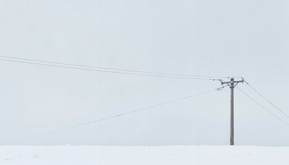 Power lines against a snowy background
