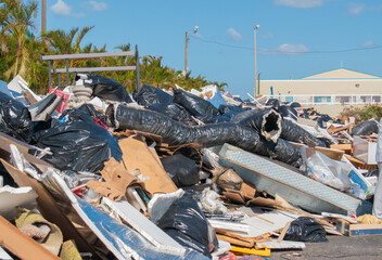 Aftermath of Hurricane Helene in Florida showing debris piles of damaged personal property and...