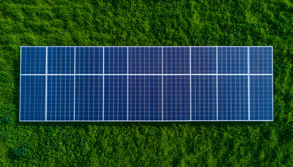Aerial View: Solar Panel Array in Lush Grass. Sustainable energy concept. Clean power solution. Eco-friendly electricity from the sun's energy. 