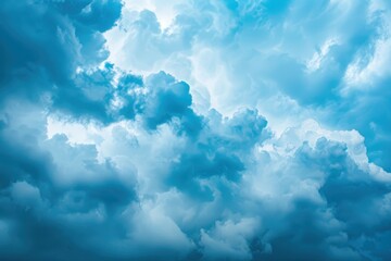 Cloud formations display a vibrant array of blues and whites, illustrating the beauty of a dramatic sky at midday