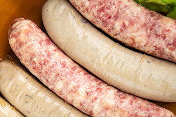 raw sausages pork, beef, chicken, fresh tasty food dish gourmet food background on the table rustic...