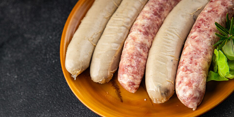 raw sausages pork, beef, chicken, fresh tasty food dish gourmet food background on the table rustic...