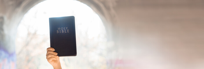 Bible in Girl's Hand: Choosing to Believe in God