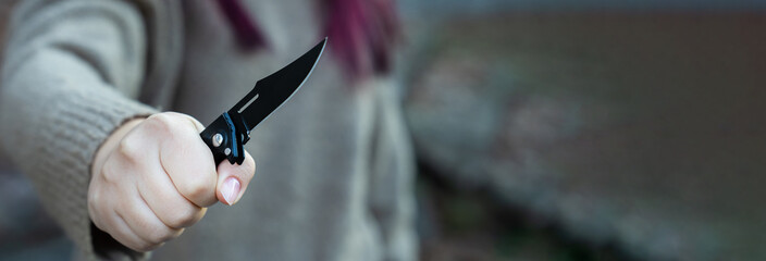 Revenge, woman with knife in hand prepares for murder