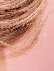 Naklejka premium Frayed hair tips with split ends captured close up against a soft pink backdrop creating a serene and delicate effect. Generative AI