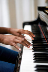Obraz premium Close-up of woman playing piano