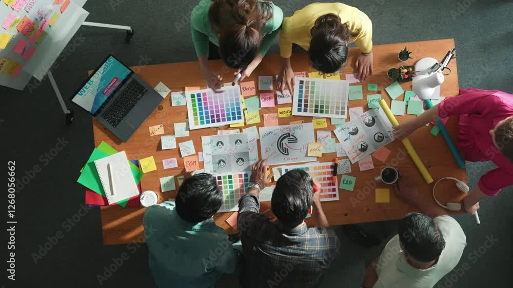 Poster top down view of designer compare color palettes with laptop and design product. aerial view of mark