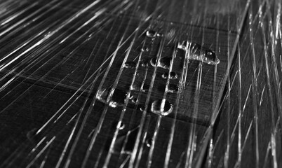 Pattern Of Water Drops On A Transparent Polyethylene Tape With Folds Grayscale Stock Image 