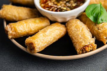 Nem rolls with sauce vietnamese rice paper roll delicious gourmet food background on the table rustic food top view copy space