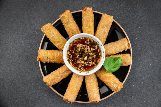 Nem rolls with sauce vietnamese rice paper roll delicious gourmet food background on the table rustic food top view copy space