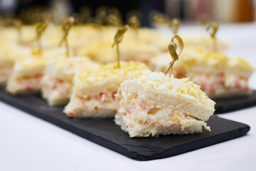 Mini chaca sandwiches with boiled egg and mayonnaise on a slate