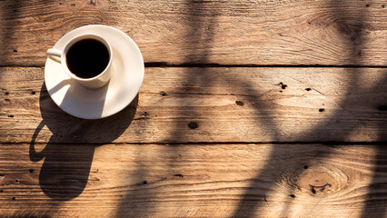 Coffee cup top view on wooden table background