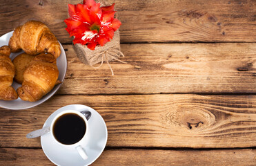 coffee ,croissan on wooden background