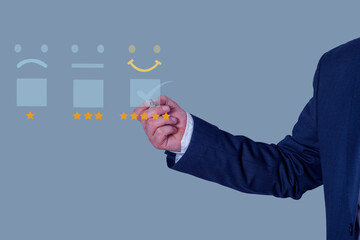 Business people touch virtual screen on happy emoticon icon