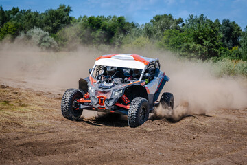 UTV buggy, ATV (quad), 4x4 in the action on sand