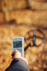 The ground metal detector is designed to search for treasures, coins and jewelry, scrap metal, close-up, while working