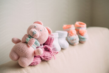 Pregnancy motherhood perenthood concept, Three pairs of baby booties , baby shower, first birthday party banner, handmade socks, daycare, kindergarten, day nursery