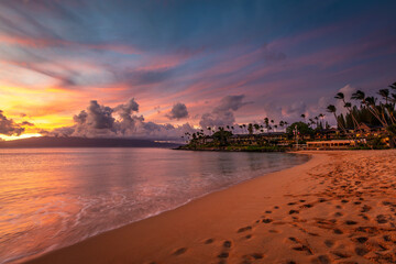 Colorful Sunset at Napili Beach, Maui with Dramatic Sky and Golden Sand