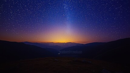 Starry Night Sky Over Majestic Mountain Ranges