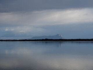 Mount circeo at Lake Fogliano on a cloudy day, Circeo National Park, Italy
