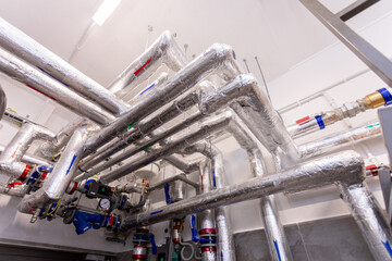 A complex pipe system in a modern facility using various technologies and strategies