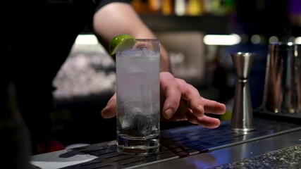 Bartender prepares a cocktail at a party in a nightclub. High quality 4k footage