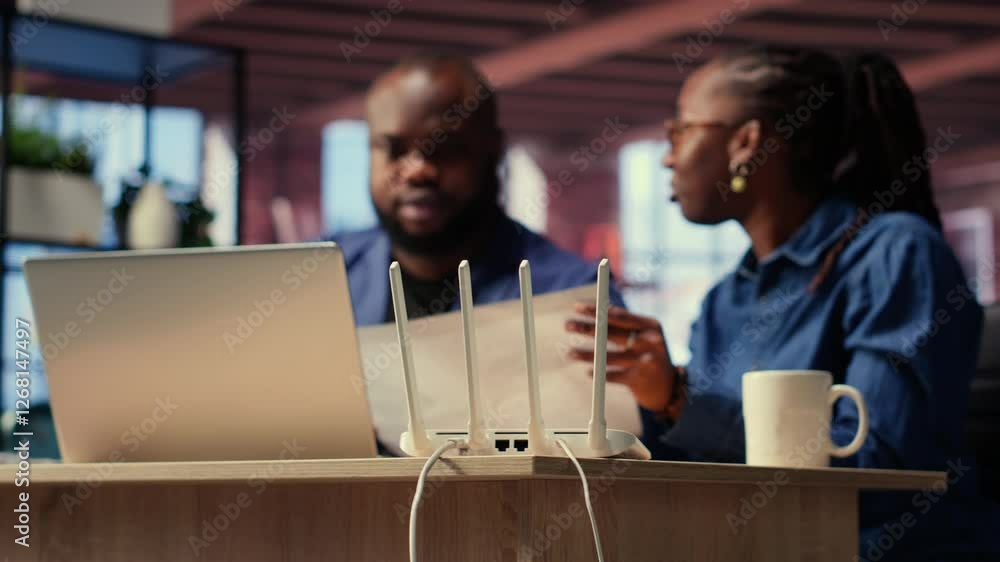 Poster black irritated man and woman rebooting their wireless router and checking network settings, feeling