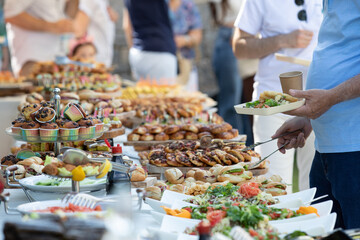 catering wedding buffet with variety of food snacks and appetizers