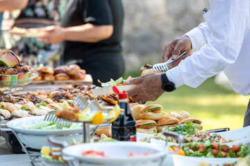 catering wedding buffet with variety of food snacks and appetizers