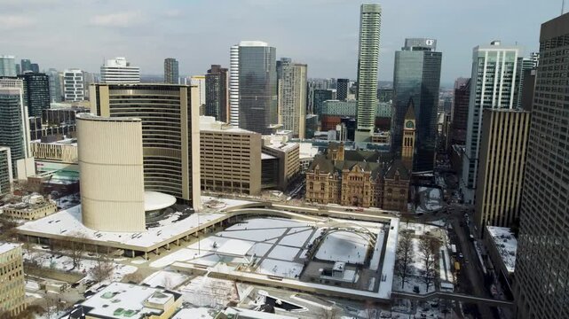 Aerial winter view of Nathan Phillips Square and Old City Hall in Toronto 4K
