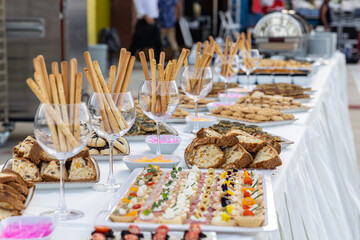 catering wedding buffet with variety of food snacks and appetizers