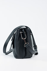 Small black leather women's bag on a white background. Lady's bag
