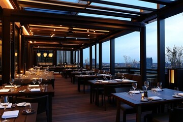 Rooftop restaurant with city view at dusk, featuring modern wooden tables and chairs under a glass and metal pergola.
