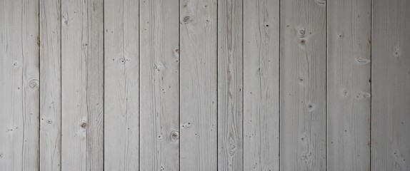 Obraz premium a wooden surface, showcasing a vertical layout of four wide planks. The wood has a weathered and rustic appearance, with a predominantly light gray color, interspersed with subtle variations in tone. 