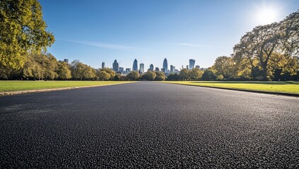 City skyline view from paved road in park.