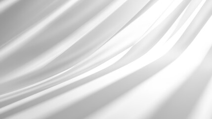 Obraz premium Soft, flowing white fabric creating delicate waves and shadows, evoking a serene and peaceful atmosphere.