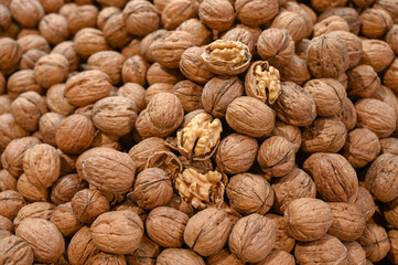 Walnuts for sale at the market. A lot of nuts in the shell.