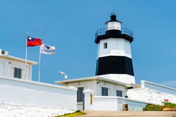 Building view of the Fuguijiao lighthouse at the northernmost proper point in New Taipei City, Taiwan.