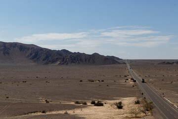 The Panamerican Highway in Peru, Nazca region, with the Andes Mountains in the background