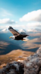 Fototapeta premium Eagle soaring above mountain range